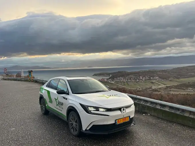 Honda electric taxi overlooking Lake Ohrid — Elbasan to Pogradec ride